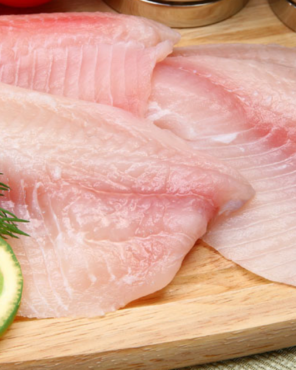 Fish fillets with slices of lime.