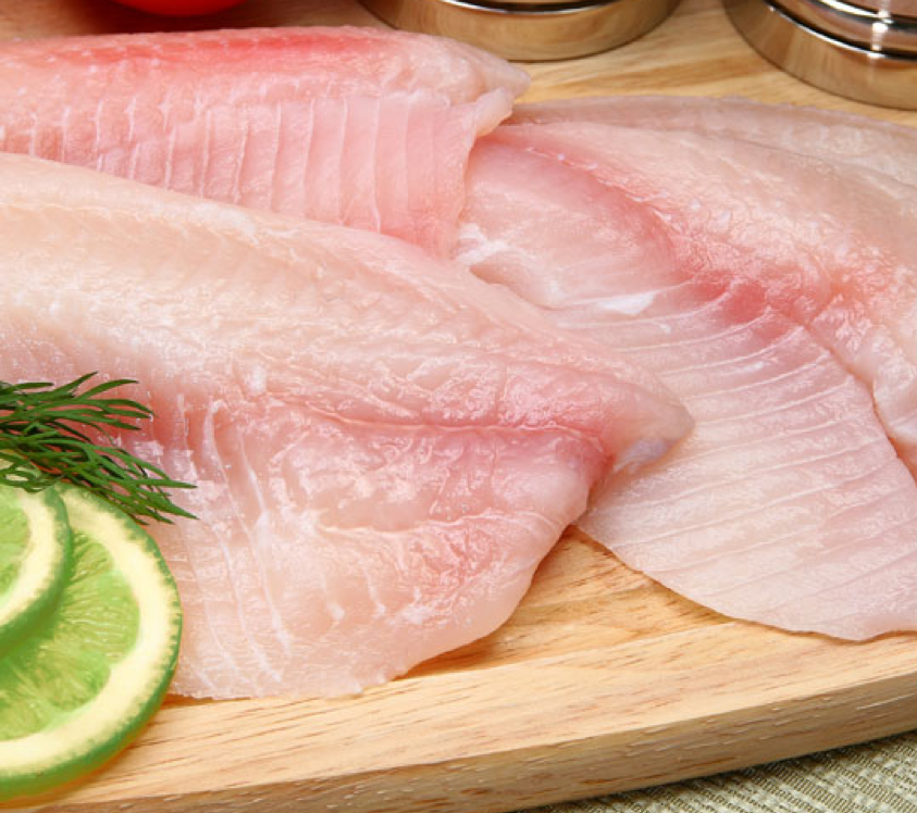 Fish fillets with slices of lime.