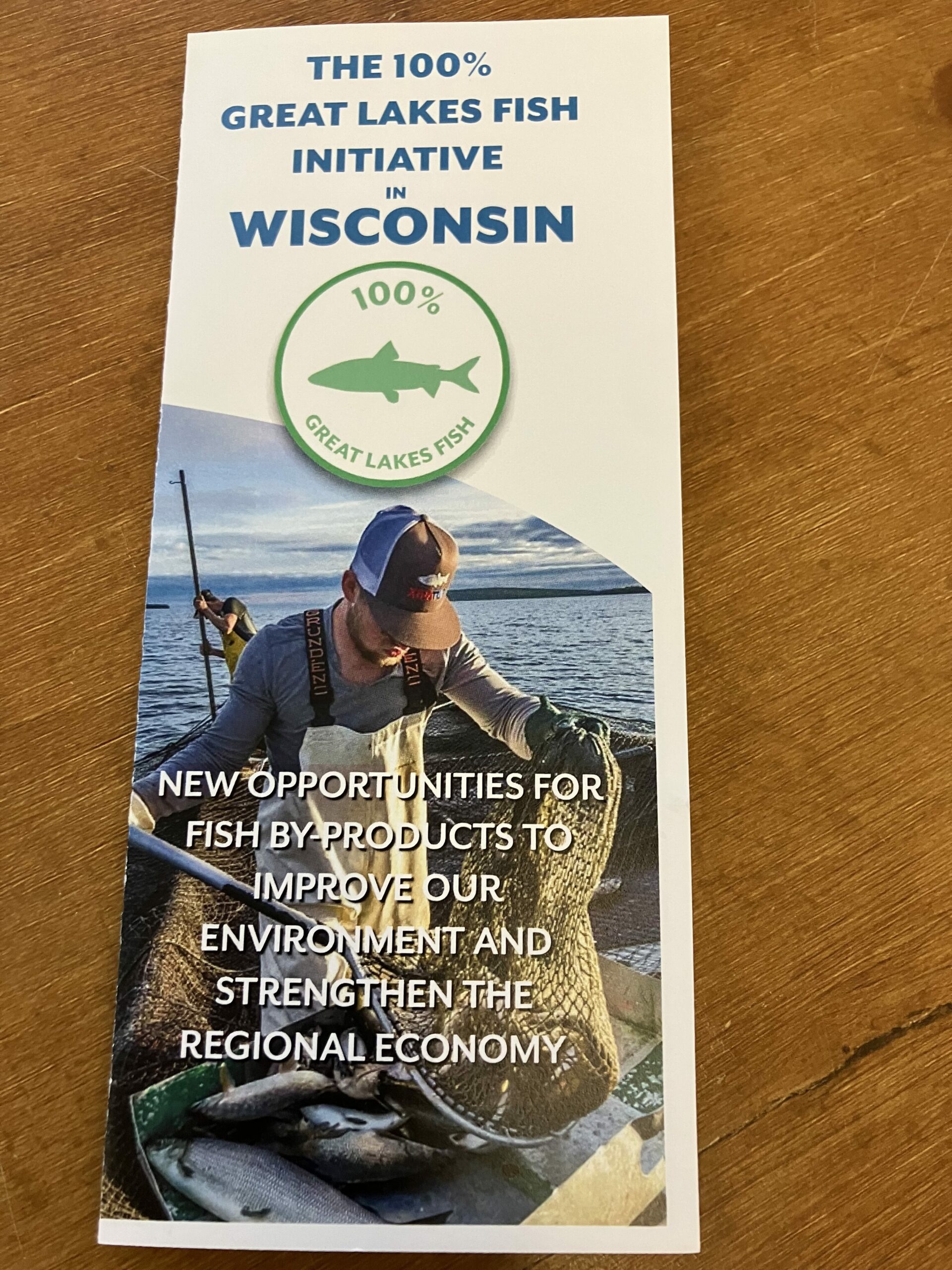 The front of the 100% Great Lakes Fish Initiative in Wisconsin brochure. New opportunities for fish by-products to improve our environment and strengthen the regional economy.